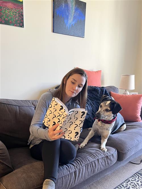 Mrs. Rohrer reading with her dog jack