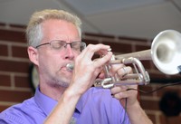 Mr. McCartney, playing the trumpet