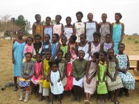 Our 8th graders make dresses which are donated to Little Dresses for Africa (LDFA). Here is a picture of girls wearing dresse